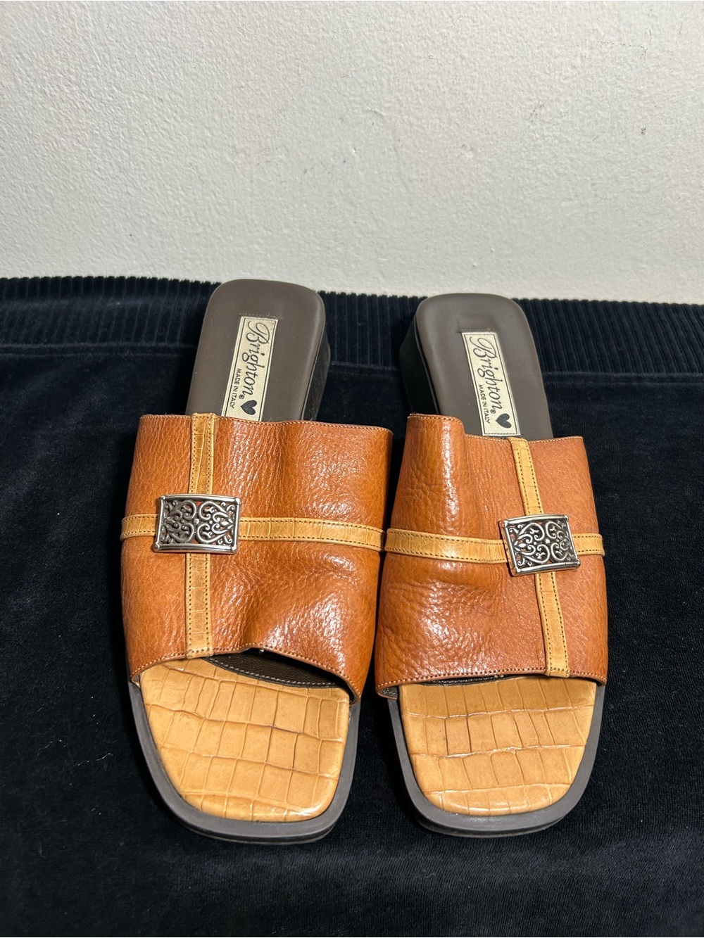 Brighton women’s Cognac & Tan Leather Slide Loafers with Decorative Metal Accent